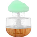 White cloud-shaped aromatherapy humidifier with night lights and USB cable.