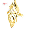 Women's exaggerated curve ring in Q611 gold colour with zircon treatment on copper
