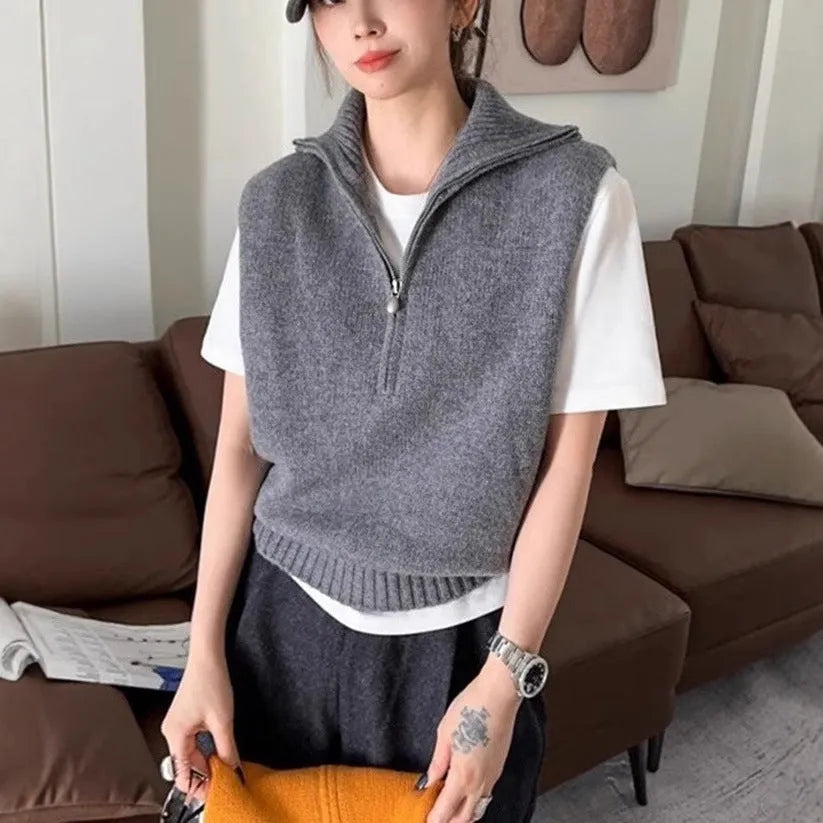 Retro half zip sleeveless knit vest in orange with 3D pattern detail