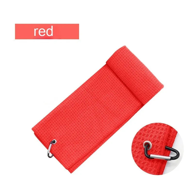Waffle weave golf ball cleaning cloth towel in assorted colours showing textured surface.