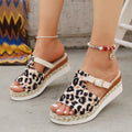Leopard print wedge platform sandals in beige on a plain background, showing fish mouth toe design.