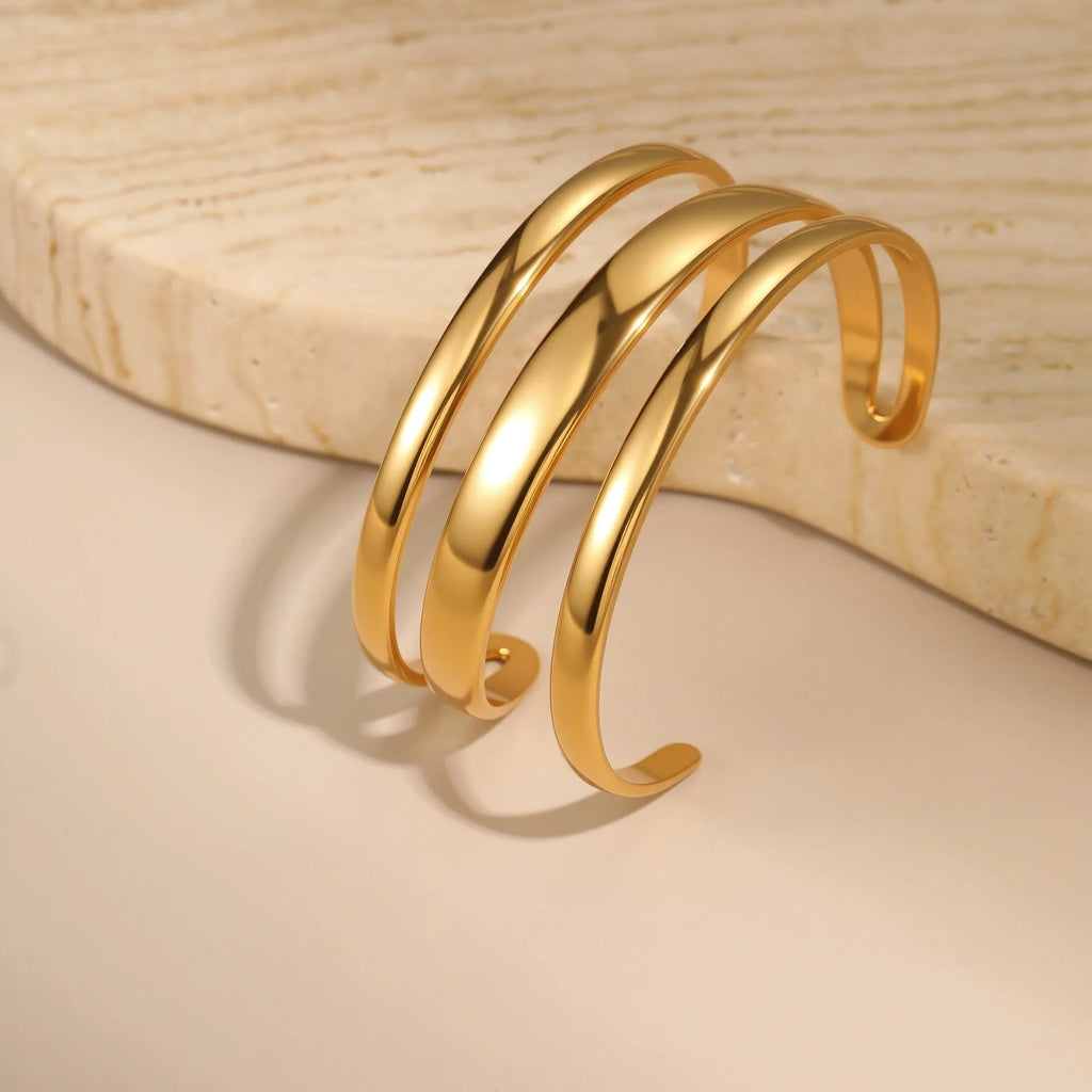 Women's geometric stainless steel bracelet with simple opening clasp in gold tone finish