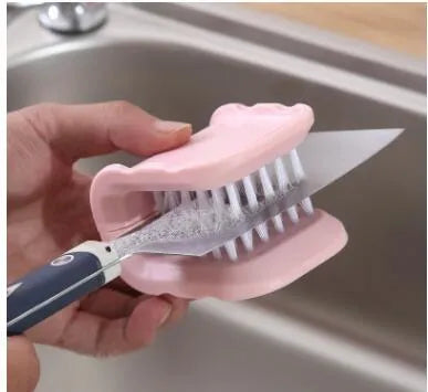 Blue U-shaped plastic brush for cleaning knives and forks in kitchen sink
