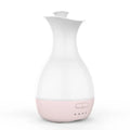 White ultrasonic humidifier with colourful night light functioning as aromatherapy diffuser and flower vase