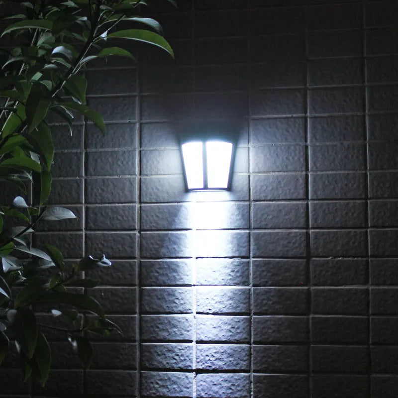 Solar-powered outdoor wall lamp with 6 LEDs and IP65 waterproof rating for garden lighting