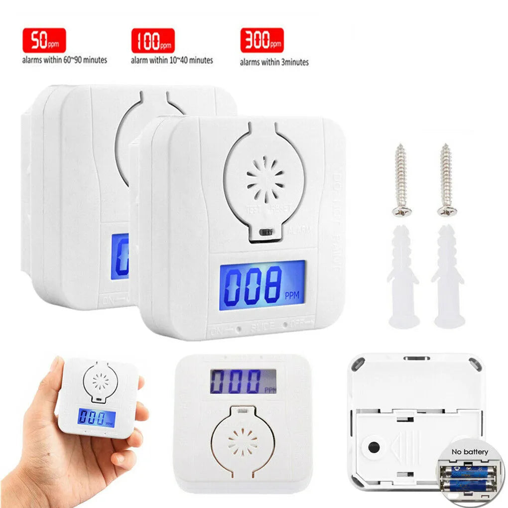 White wireless carbon monoxide alarm mounted on a wall for detecting coal and soot gas.