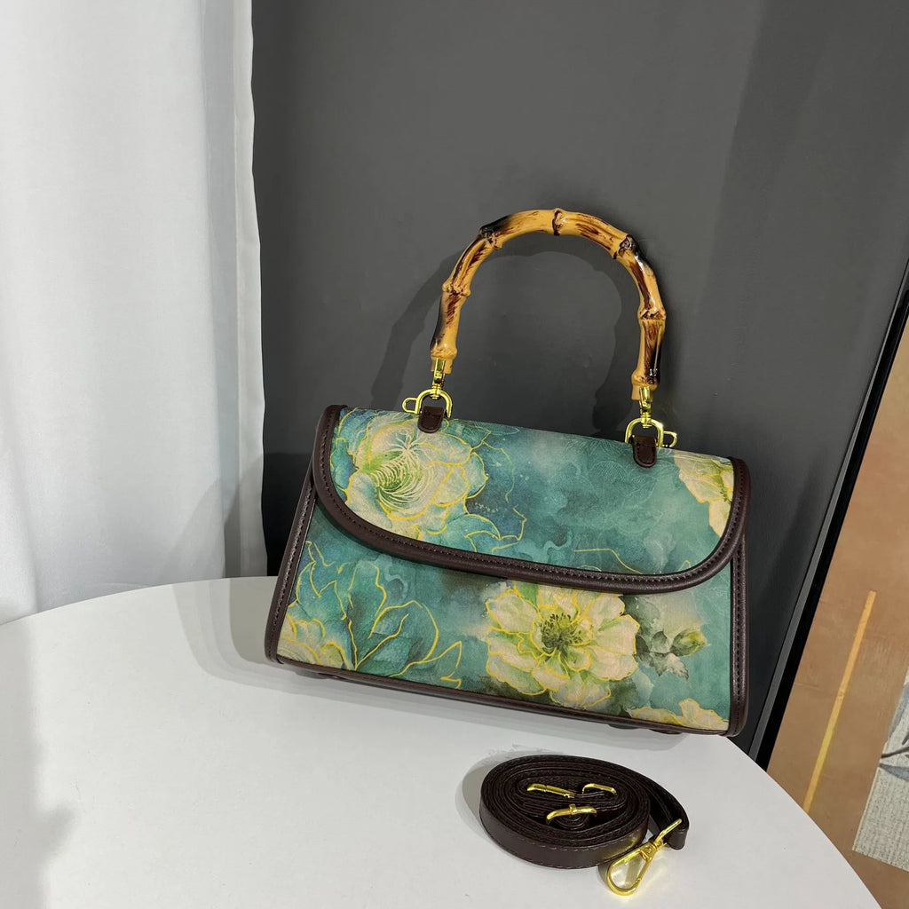 Vintage Chinese-style Xiangyun silk handbag with retro patterns, horizontal rectangular shape and single strap.