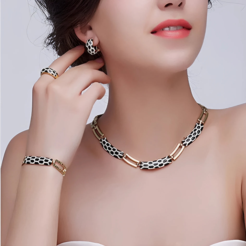 Costume jewellery set for women with 18K electroplated alloy, drop oil detail, and water drill accents in black, purple, or white.