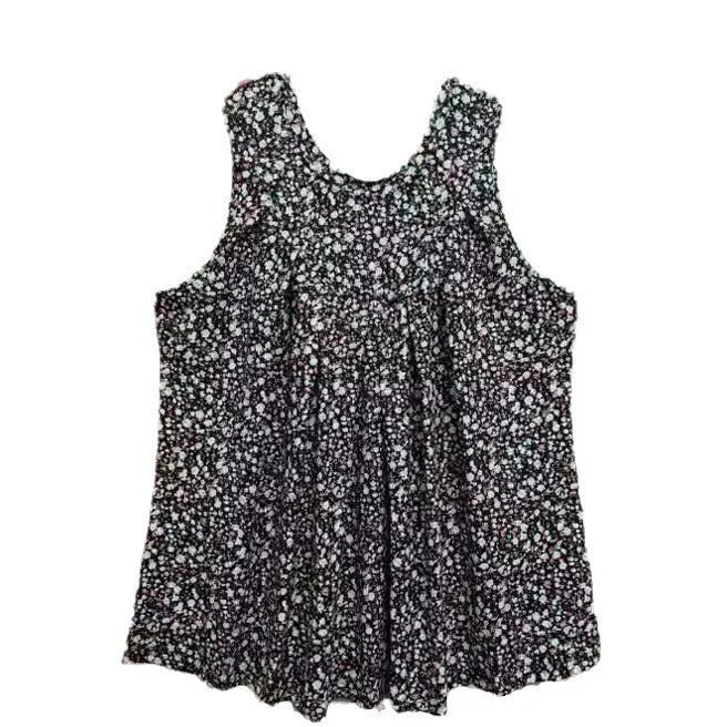 Plus-size black floral print sleeveless vest with round neck on a hanger, showing loose fit.