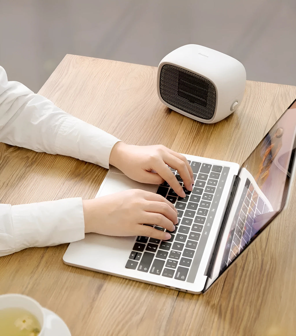Compact green mini ceramic desk heater with metal grille, shown with dimensions.