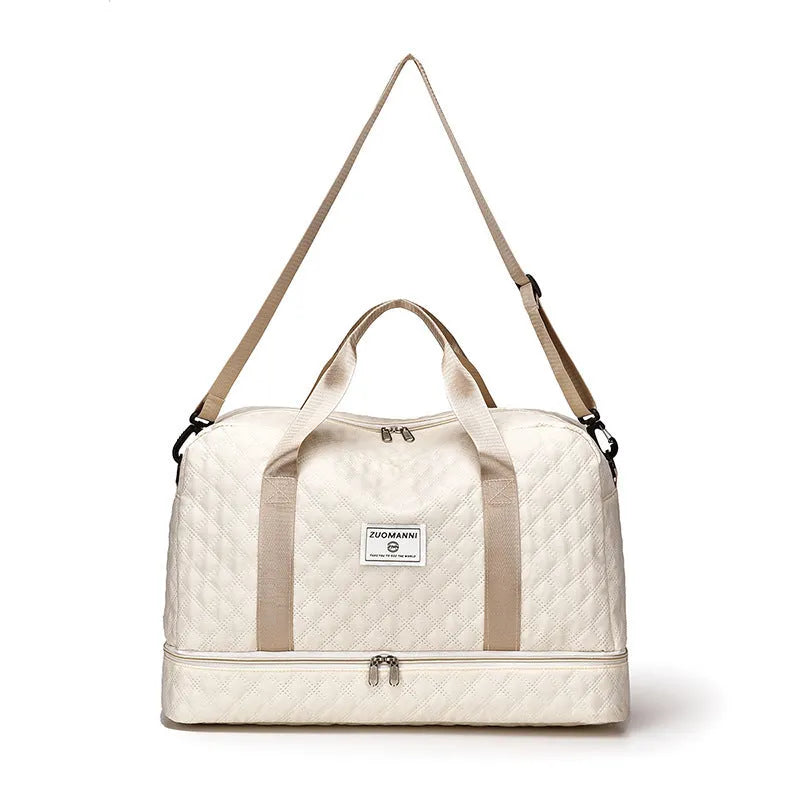 Large Oxford cloth travel bag in a solid colour with sewing thread details.
