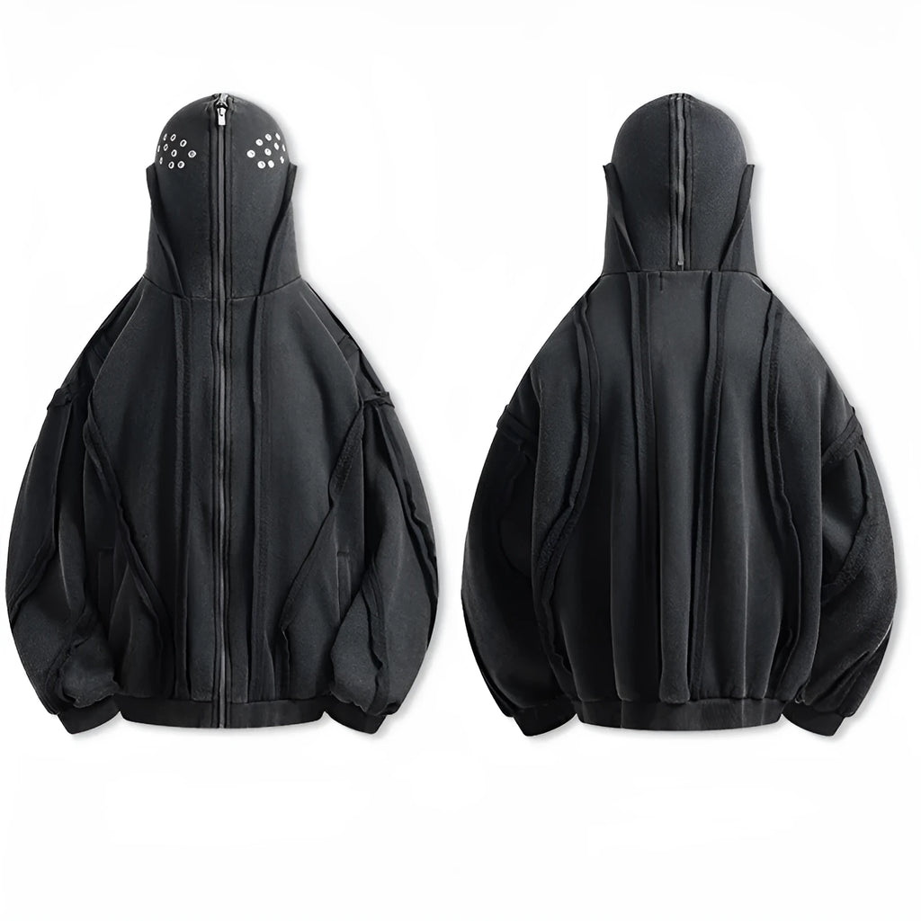 Man wearing a black retro-style zip-front cotton hooded coat with abstract pattern.