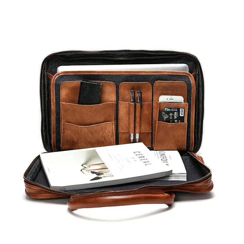 Men's vintage brown leather briefcase open to show internal laptop and camera pockets.