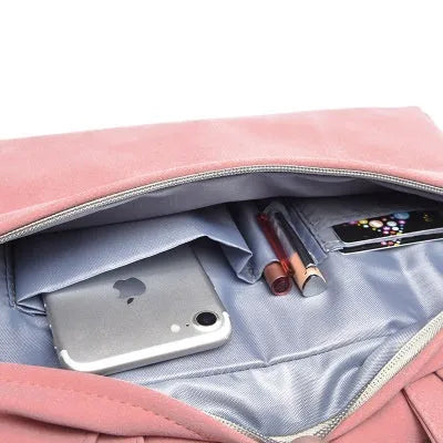 PU leather laptop bag in Black on a table, with zipper closure and removable shoulder strap