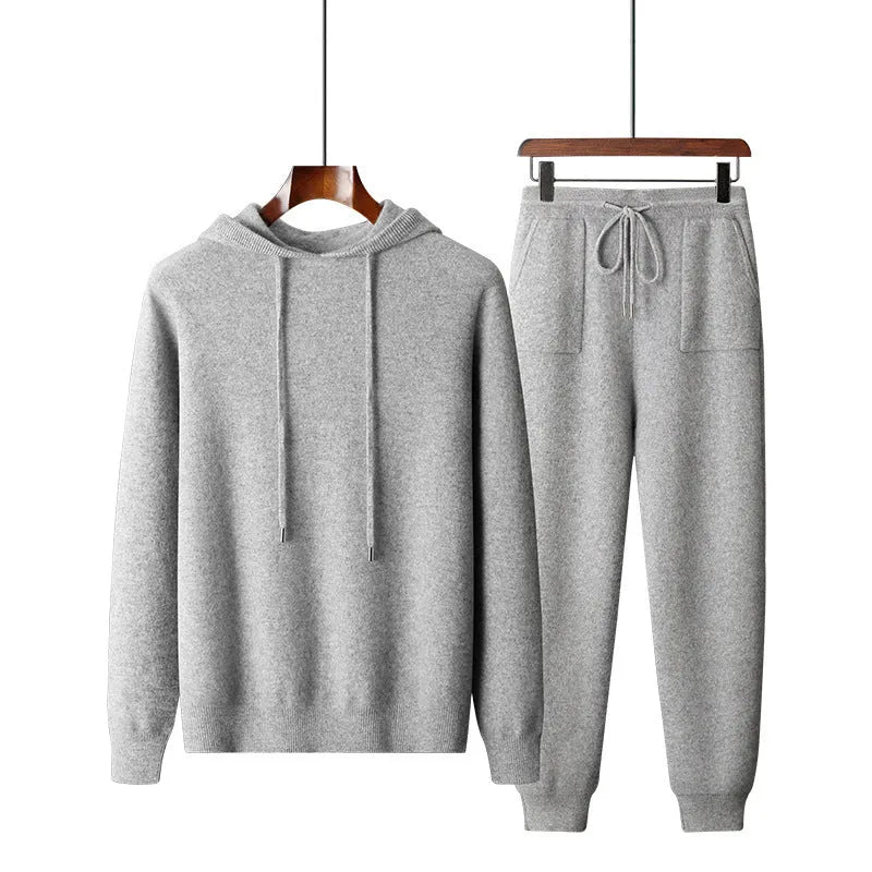 Men's light gray cashmere blend hoodie and matching long pants set on a hanger.