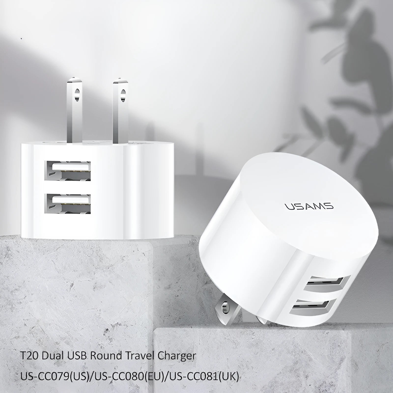 White dual USB phone charger with international plugs for US EU UK regions showing compact 39mm diameter design