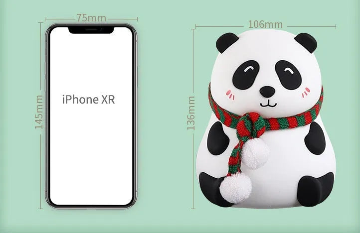 Panda-shaped silicone night light with USB cable on a wooden surface