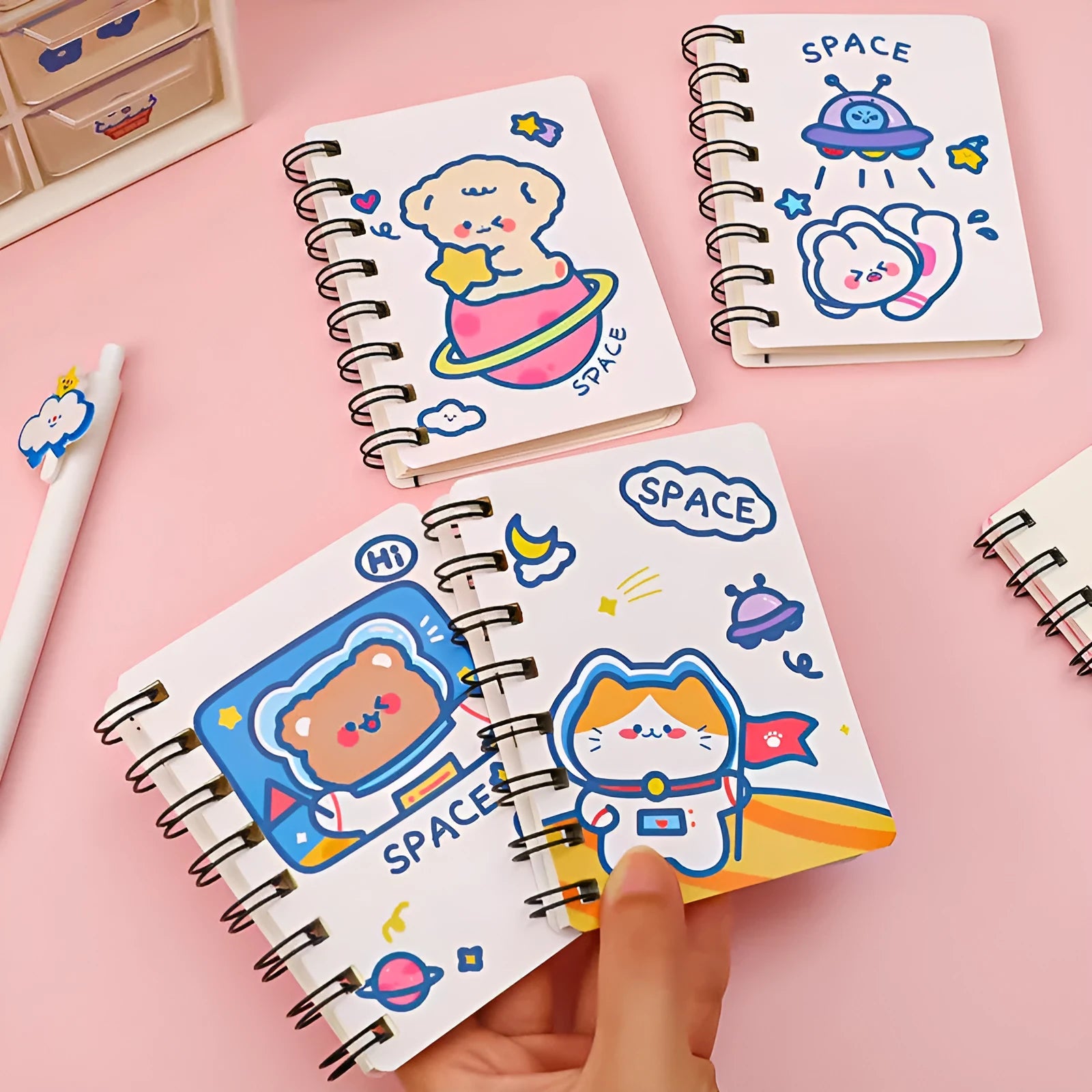 Astronaut Series pocket flipper notebook showing 10.5 by 8 cm size with choice of four space-themed cover designs.