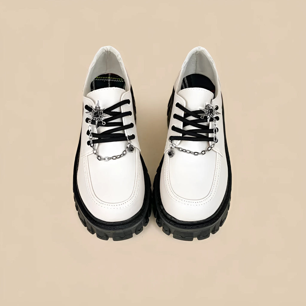 Women's preppy style loafers in Duke Asterism colour with a cross strap and metal buckle.