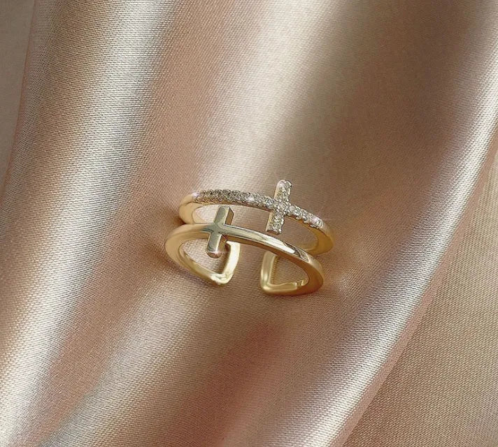 Adjustable copper ring with sterling silver inlay and white gold finish, featuring a zircon stone.