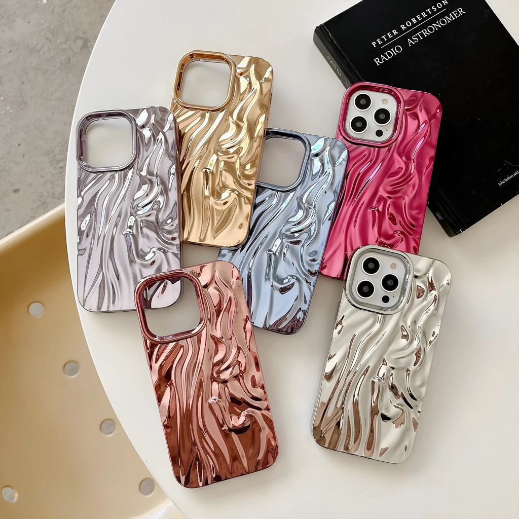 Soft TPU iPhone case with a textured three-dimensional pleated pattern in an electroplated gold finish.