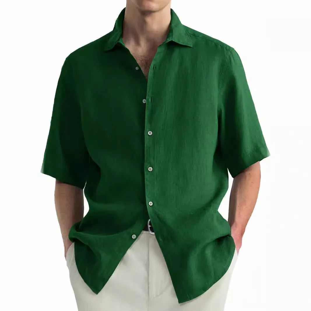 Green men's casual cotton shirt with a cardigan collar laid flat.