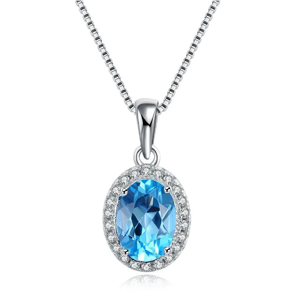 925 sterling silver geometric jewellery set with blue topaz gems including earrings, ring, necklace and pendant