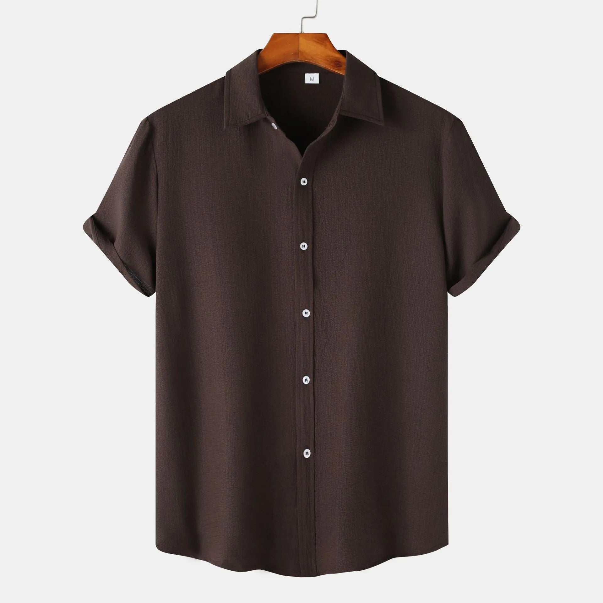 Men's casual short-sleeved polyester shirt in cardigan style on a hanger