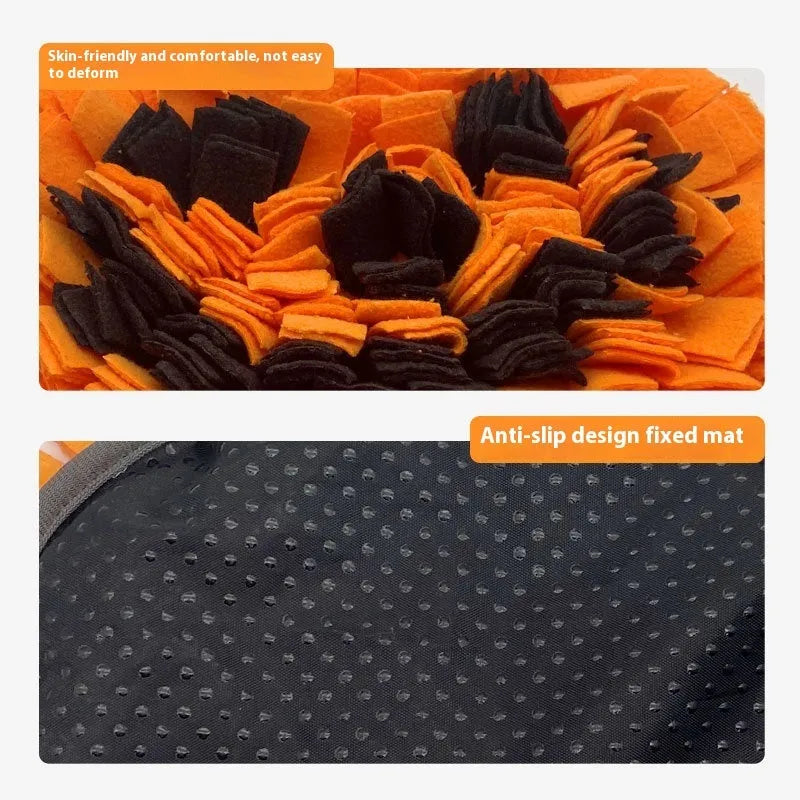 Orange pumpkin-shaped fleece pet slow feeder mat for dogs and cats on a floor.