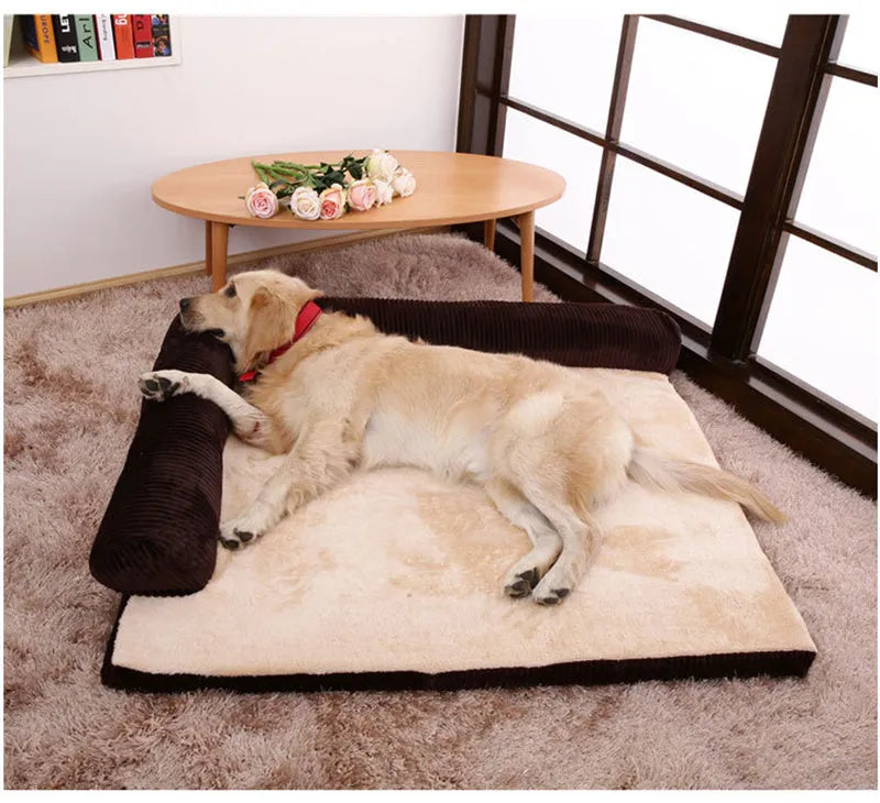 Corduroy dog sofa bed with bolster sides on a wooden floor, showing grey colour option in large size.