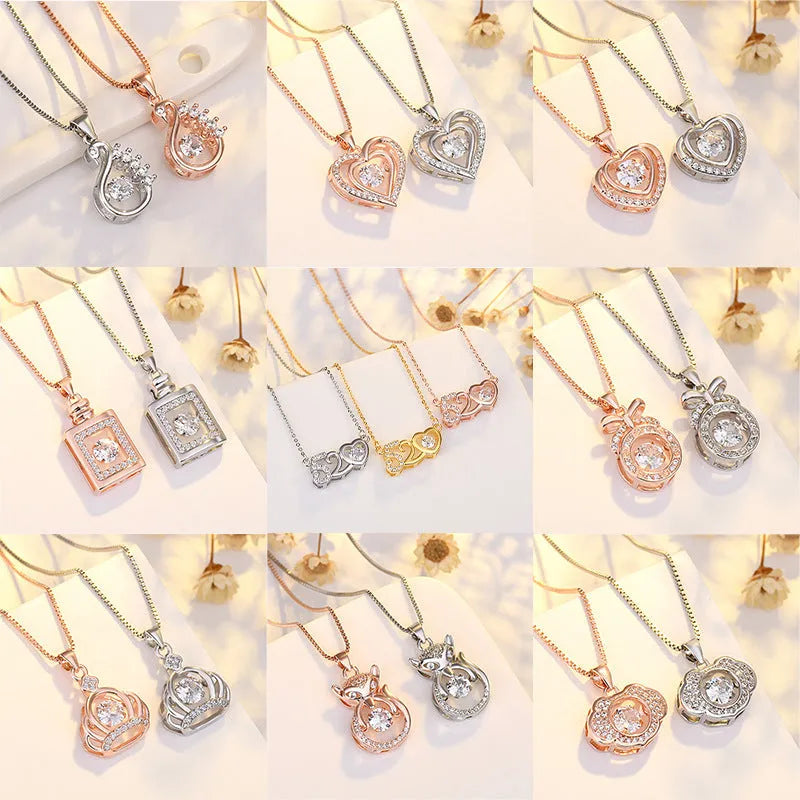 Sterling silver heart necklace with crown detail on a 45 cm chain, shown in silver and rose gold finishes.