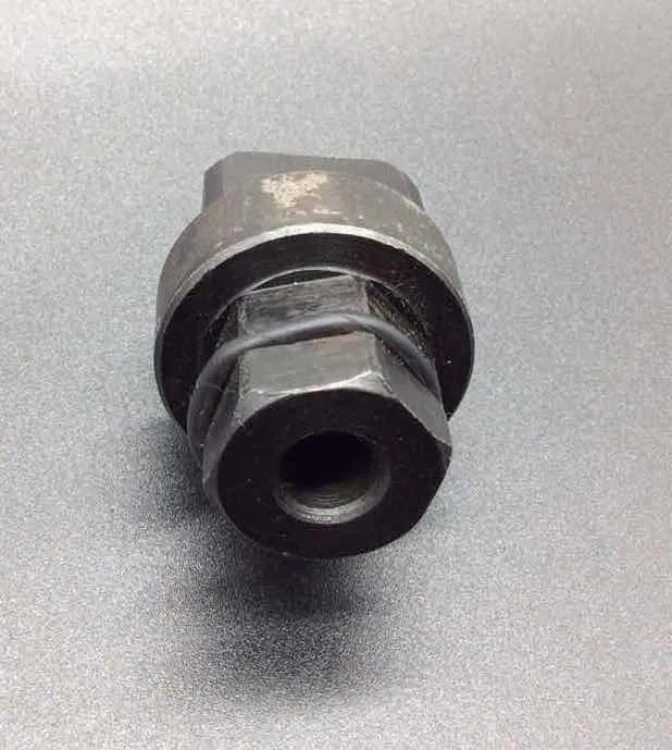 Aodi T40058 crankshaft rotating sleeve and timing tool adapter for engine service.