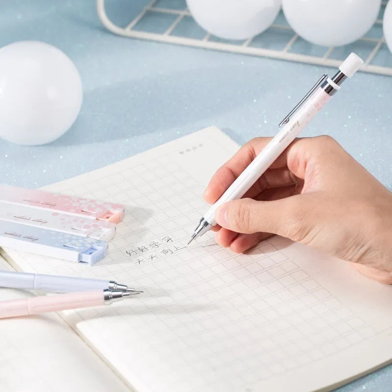 Cartoon style 0.5mm automatic pencil set with three pencils and three HB lead refill boxes.