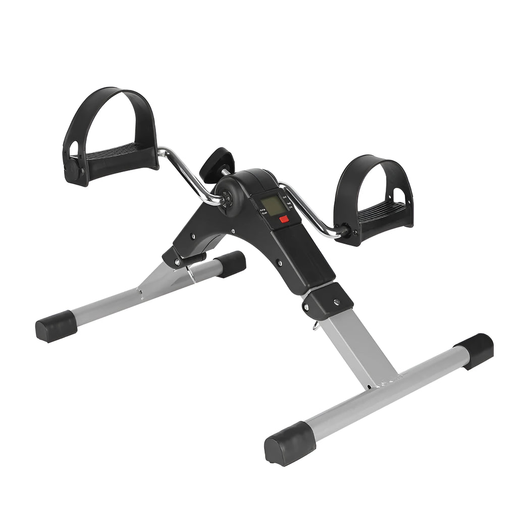 Silver and black exercise mini spinning bike on hard floor with pedals and non-slip foot pads