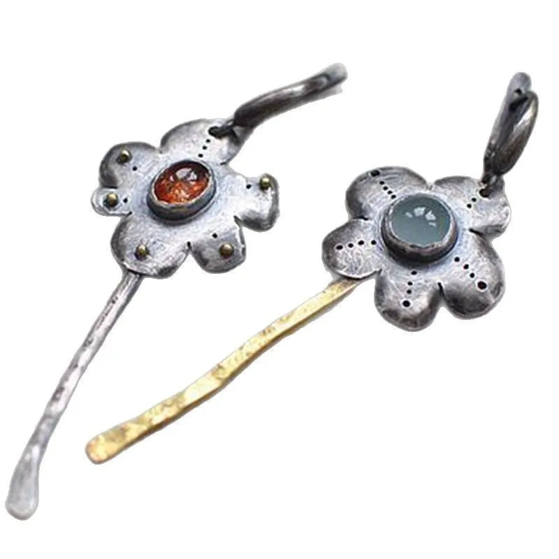 Long geometric flower earrings with two-tone asymmetrical colour on alloy metal.
