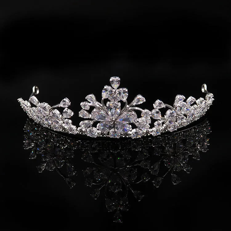 Three-piece Korean bridal jewellery set with headdress, crown necklace, and earrings on display