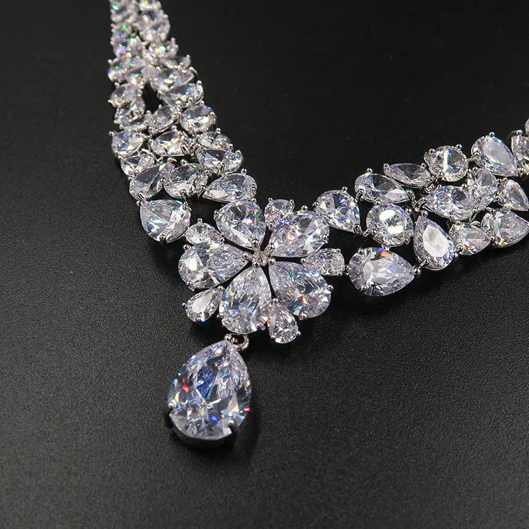 Three-piece Korean bridal jewellery set with headdress, crown necklace, and earrings on display