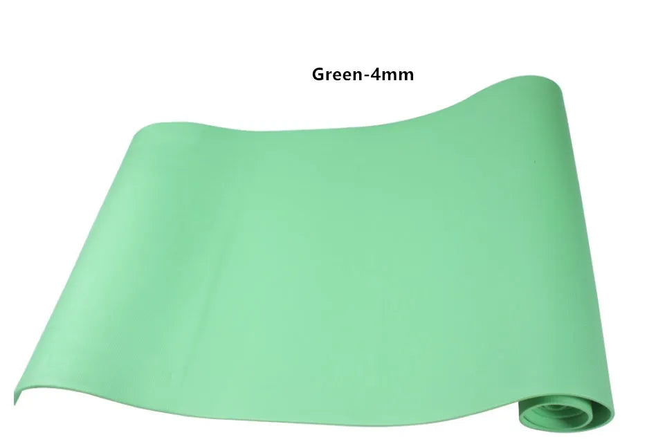 Red EVA yoga mat showing thickness, next to a blue mat, on a wooden floor.