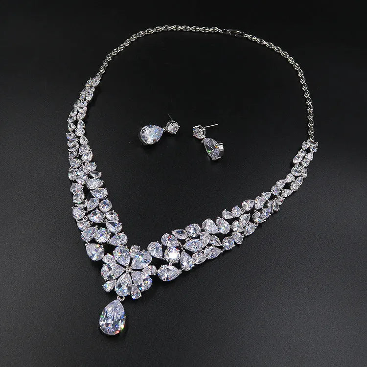 Three-piece Korean bridal jewellery set with headdress, crown necklace, and earrings on display