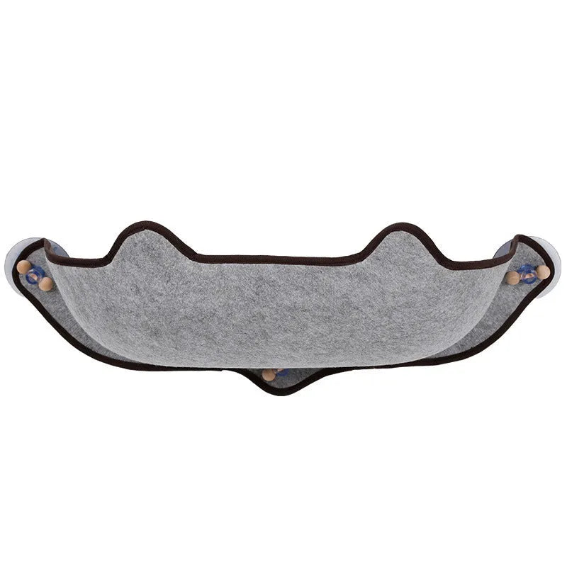 Cat sleeping on a window sill hammock made of EVA and felt cloth, secured by three 8.5cm suction cups