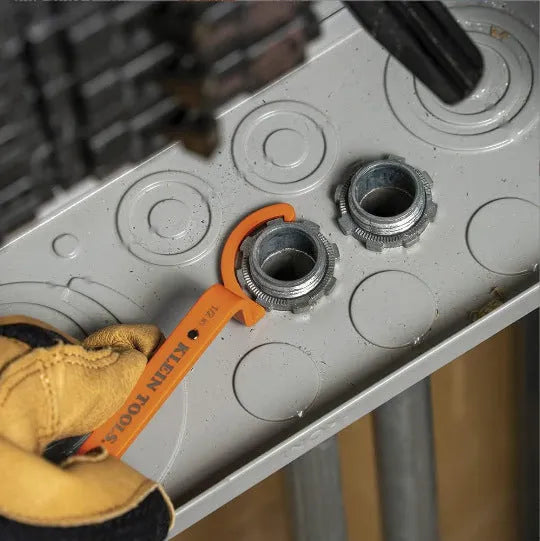 Three magnetic crescent wrenches in orange, grey, and black with locking mechanism and suction feature