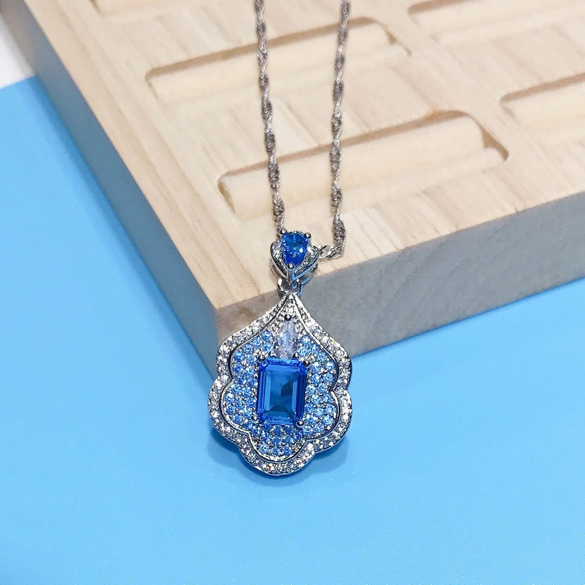 Sea blue geometric copper pendant with aquamarine and topaz mirror finish jewellery piece