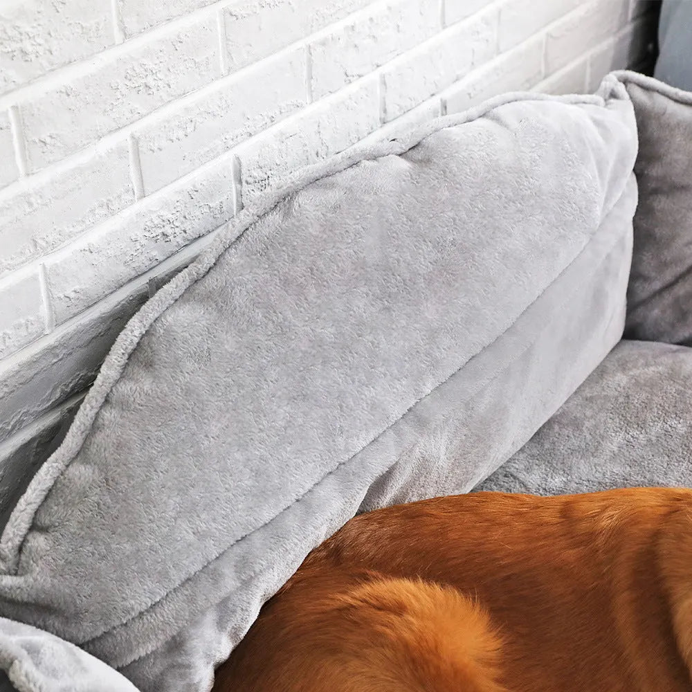 Grey dog bed sofa bed with raised edges and foam padding in XL size