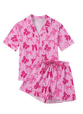 Pink bow print two-piece polyester pajama set with matching top and pants