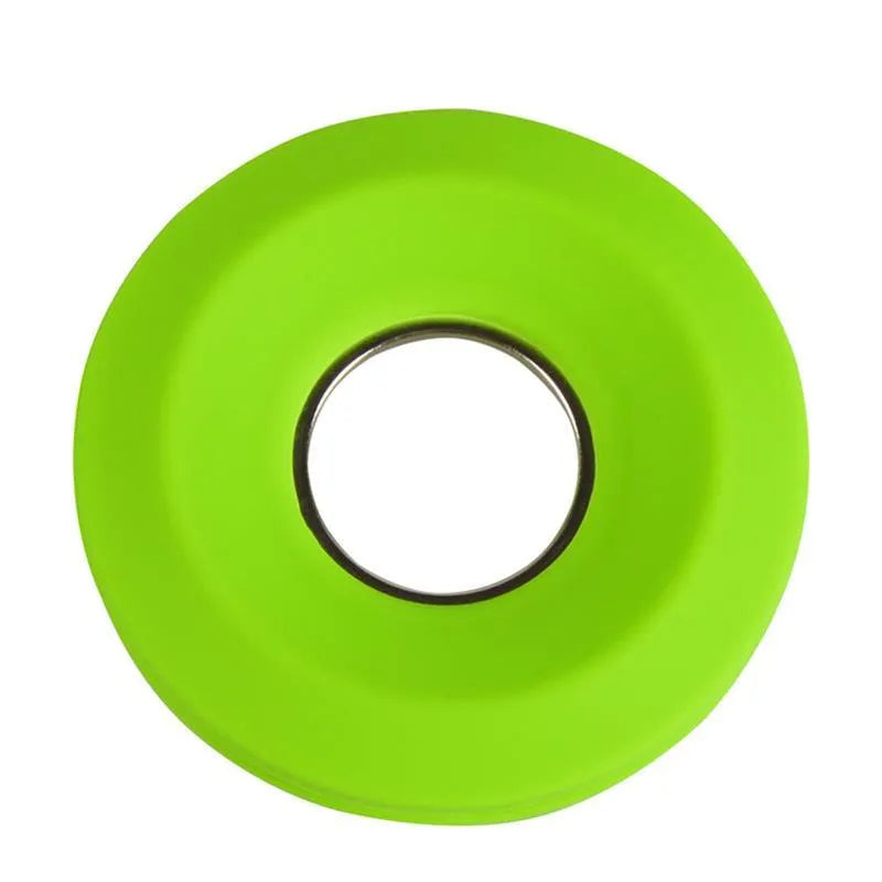 Light grey silicone donut cord reel with suction cup base and magnet for organising phone and earphone cables.