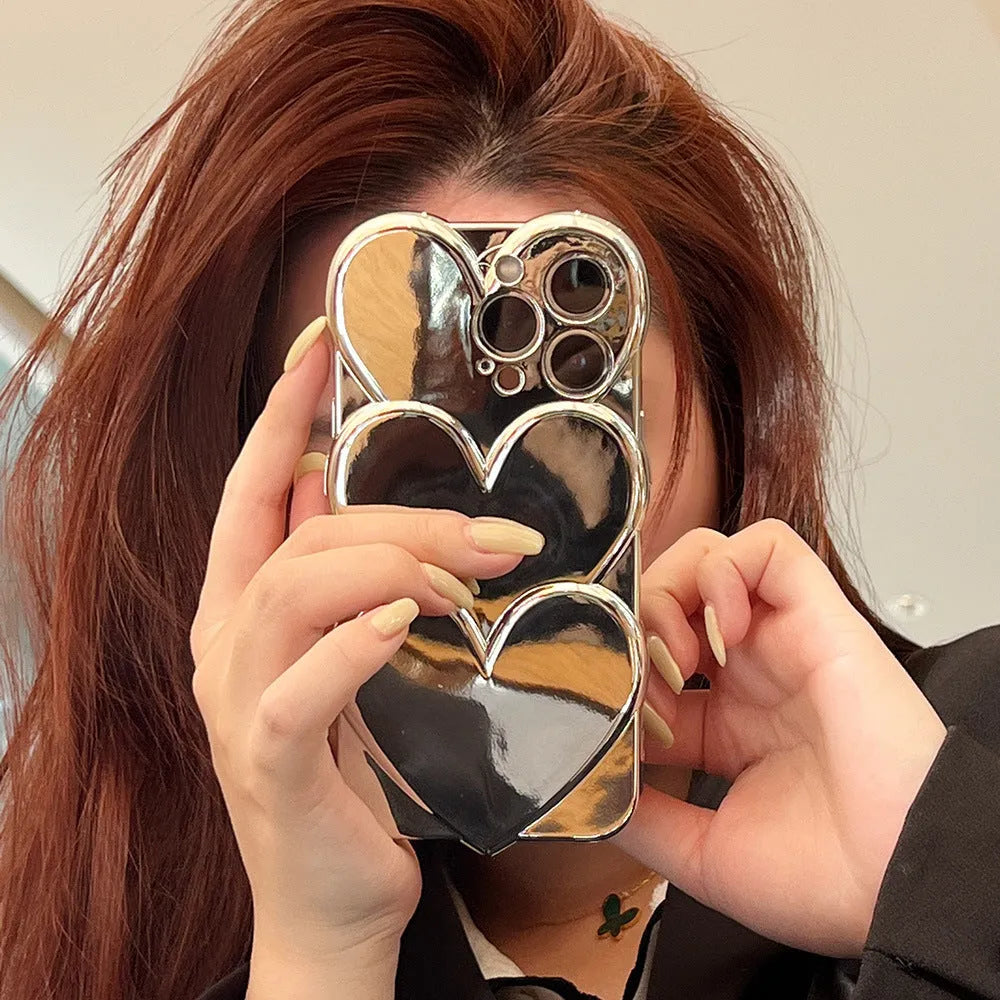 Flexible TPU iPhone case with a silver electroplated three-dimensional love design on the back.