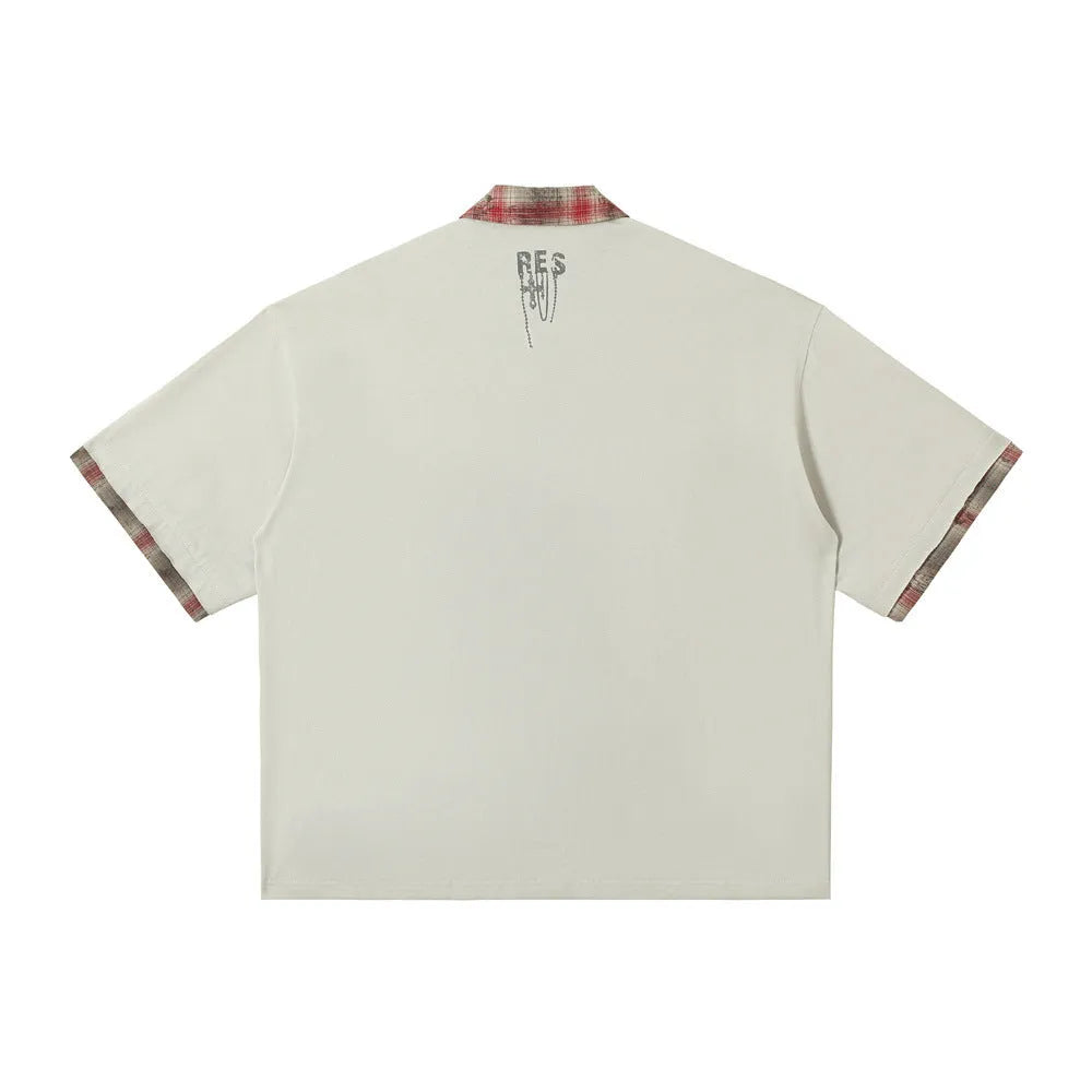Men's loose blue cotton top with asymmetric lapel and graffiti print, short sleeves.