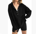 Women's loose peach-coloured pullover sweater with raglan sleeves on a hanger.