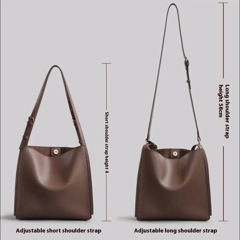 Brown genuine leather retro-style women's commuter bag with dual shoulder straps and external slit pocket.