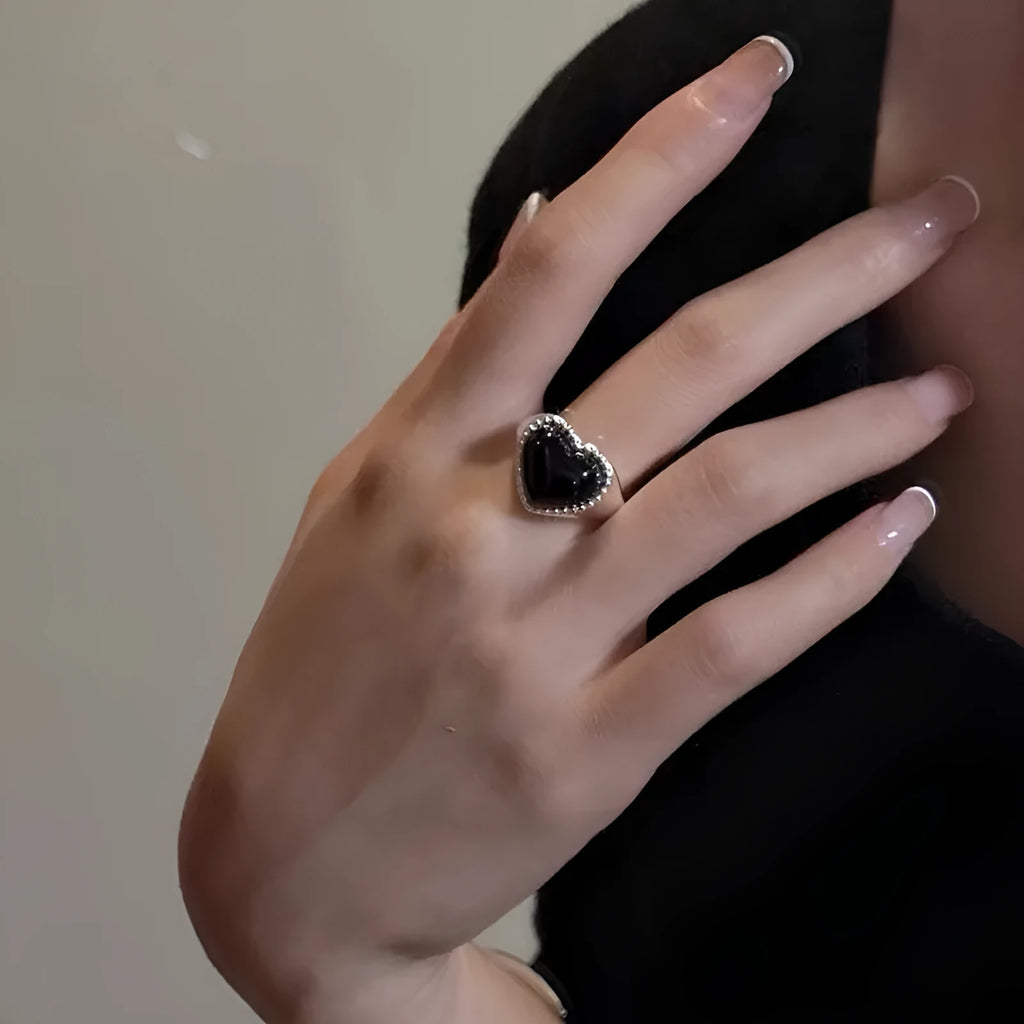 Adjustable sterling silver ring with heart-shaped black agate stone on open mouth design